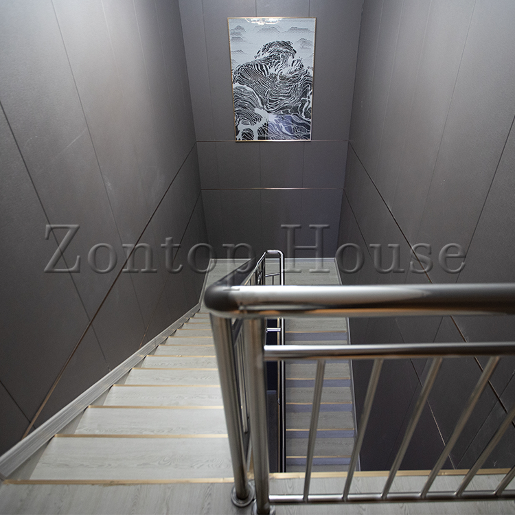 the-model-6-features-an-offset-layout-the-main-entrance-is-recessed-and-a-small-hallway-leads-to-the-bathroom-and-two-bedrooms-the-kitchen-is-open-to-the-living-and-dining-space.png the-model-6-features-an-offset-layout-the-main-entrance-is-recessed-and-a-small-hallway-leads-to-the-bathroom-and-two-bedrooms-the-kitchen-is-open-to-the-living-and-dining-space.png